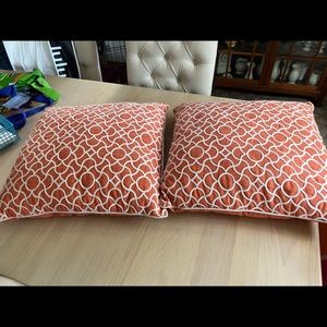 2 coral throw pillows